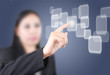Business lady pushing button on the touch screen interface.
