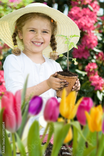 Photo: Lovely gardener in spring garden Lovely gardener in spring garden