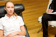 psychiatrist examining a female patient