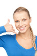woman making a call me gesture