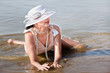 Photo: Woman in white hat against the sea Woman in white hat against the sea
