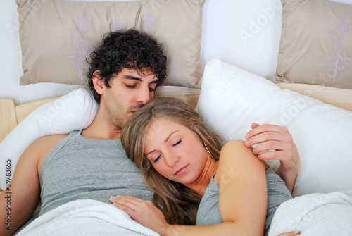 Photo: young couple sleeping young couple sleeping