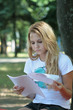 The girl in park prepares for examinations