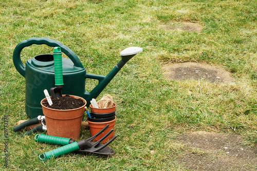 Photo: Gardening implements on the grass lawn Gardening implements on the grass lawn