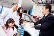 Family with a car salesman