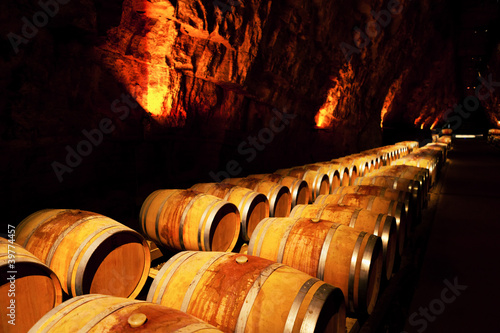 Photo: wine barrels in a winery, France wine barrels in a winery, France