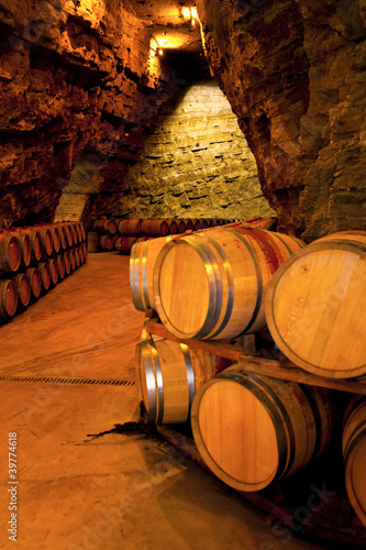 Photo: wine barrels in a winery, France wine barrels in a winery, France