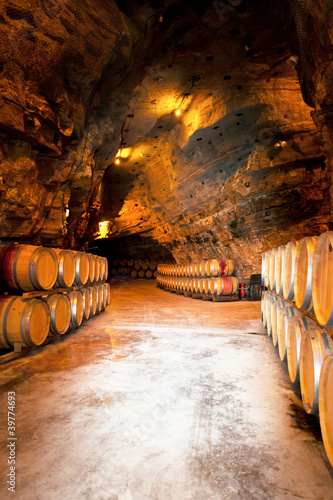 Photo: wine barrels in a winery, France wine barrels in a winery, France