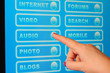 Hand pressing audio button