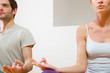 couple sitting on floor doing yoga