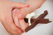 children hands holding crucifix