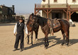 Sheriff holding two horses at Mini Hollywood Sheriff holding two horses at Mini Hollywood