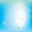 Light blue background with creme, drops and leaves Light blue background with creme, drops and leaves