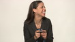 Video: Happy young business woman in studio with smart phone Happy young business woman in studio with smart phone