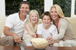 Happy Family Eating Popcorn Watching Television