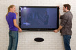 couple hanging television