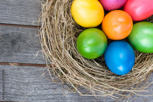 Photo: Easter basket with colored eggs Easter basket with colored eggs