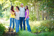 Family portrait - Family of four with a cute dog outdoors