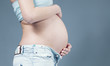 Closeup of belly with hands on it Closeup of belly with hands on it