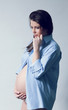 Beautiful thinking smiling pregnant white woman Beautiful thinking smiling pregnant white woman