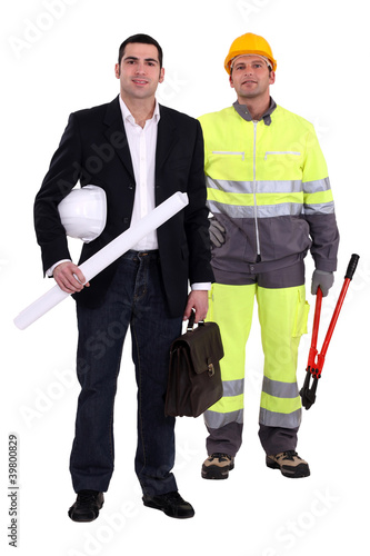 Photo: Tradesman and engineer standing side by side Tradesman and engineer standing side by side
