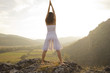 Raising arms to greet the sun
