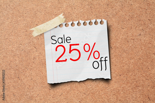Photo: sale off price tag on paper post on wooden board. sale off price tag on paper post on wooden board.