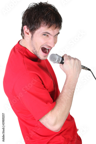 Photo: Man singing into the microphone Man singing into the microphone