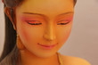 The statue faces the beautiful Thai women.
