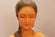 Thai women face the statue