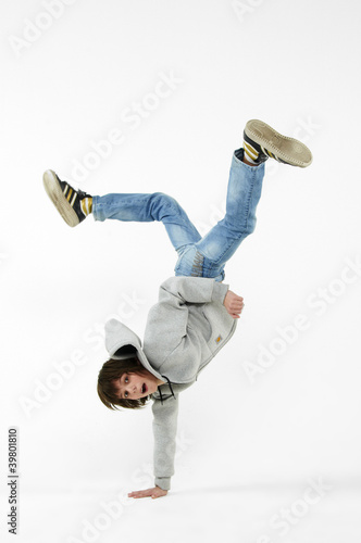 Photo: boy dancing break dance on a white background boy dancing break dance on a white background