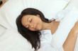 Woman asleep in her bed
