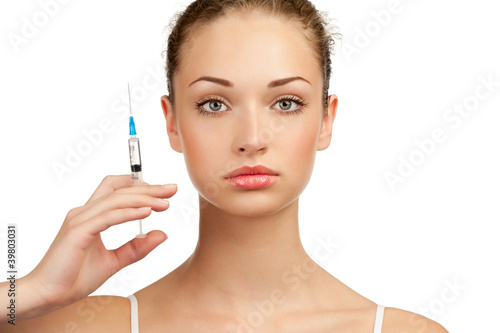 Photo: Beautiful woman with syringe in her hand Beautiful woman with syringe in her hand