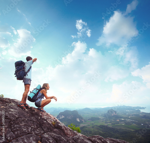 Photo: Backpackers on a rock Backpackers on a rock
