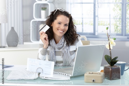 Photo: Happy woman shopping on Internet Happy woman shopping on Internet