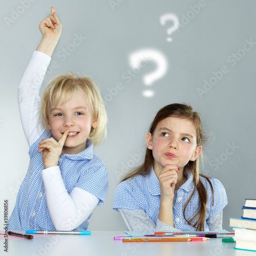Photo: Two classmates thinking about difficult homeworks Two classmates thinking about difficult homeworks