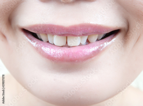Photo: Lips of an Asian young woman. Lips of an Asian young woman.