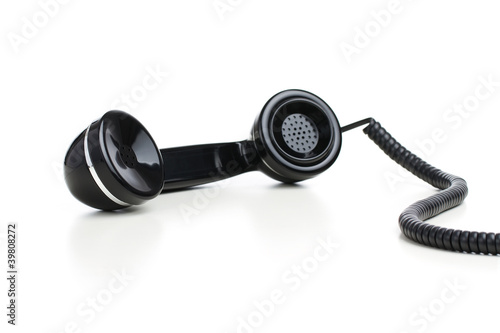 Photo: Vintage telephone reciver isolated on white background Vintage telephone reciver isolated on white background