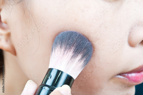 Photo: Close up Asian young woman make up. Close up Asian young woman make up.