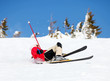 Photo: Girl skier falling down white on mountain slope Girl skier falling down white on mountain slope