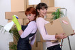 Young women cleaning out their apartment on moving day