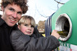 Father and son recycling glass bottles