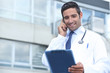 Young doctor stood outside hospital