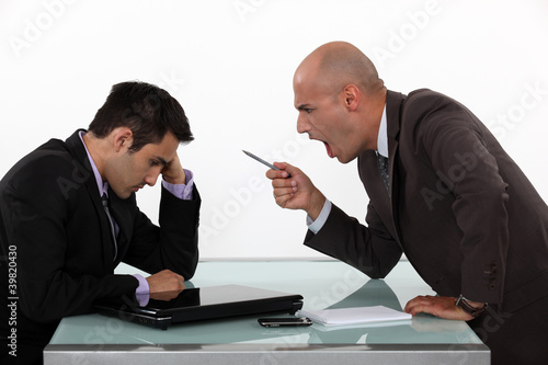 Photo: Boss shouting at employee Boss shouting at employee