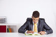 Businessman reading a book Businessman reading a book