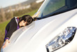 .Woman embracing her new car