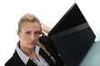 Bored woman working on her laptop