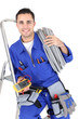 Electrician with a voltmeter and cable