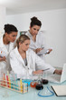 A scientist team examining the results of an experiment