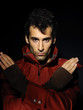 Photo: portrait of serious man over dark background portrait of serious man over dark background